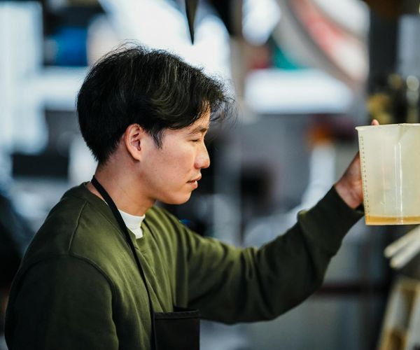 Close up of a man concentrating during a difficult physical task.